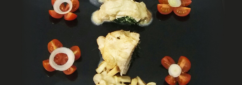 Chicken breast in white sauce stuffed with spinach
